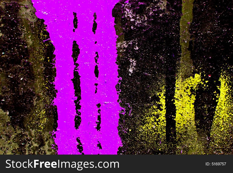 Colorful paint leaking on black background