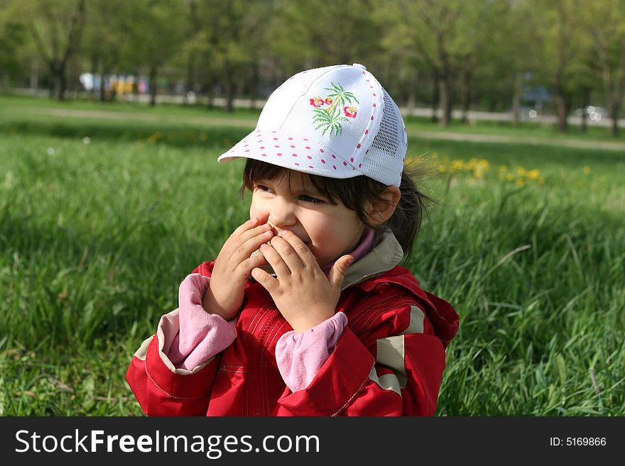 Little girl happy smilling in spring park