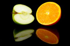 Apple & Orange Halves Stock Images Apple & Orange Halves Stock Images