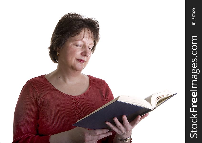 A woman in red on a white background reading a book. A woman in red on a white background reading a book