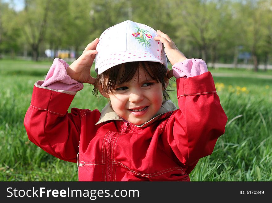 Little girl happy smiling in spring park