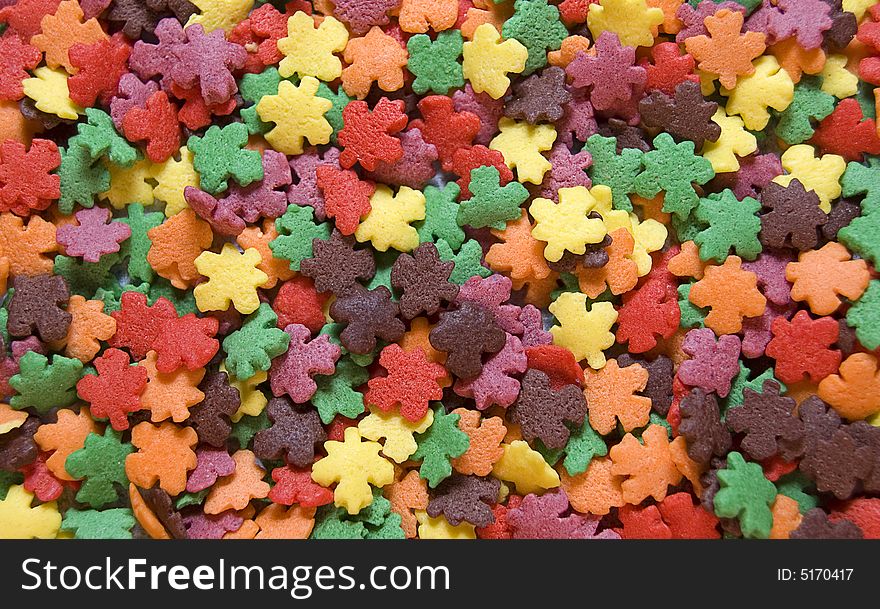Full frame photograph of small leaf shaped candies in autumn colors. Full frame photograph of small leaf shaped candies in autumn colors.