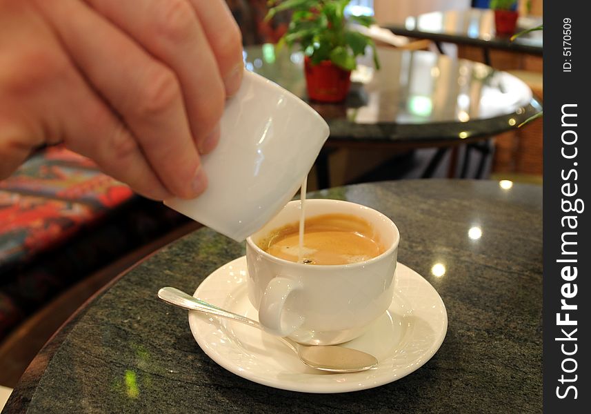 Morning coffee with milk in the hostel