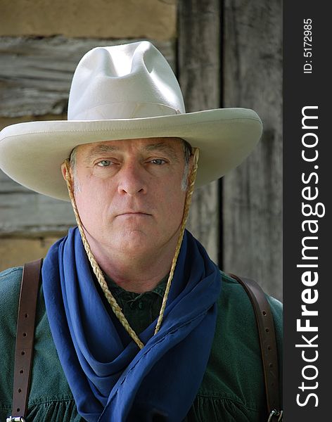 Portrait of tough looking cowboy in white hat