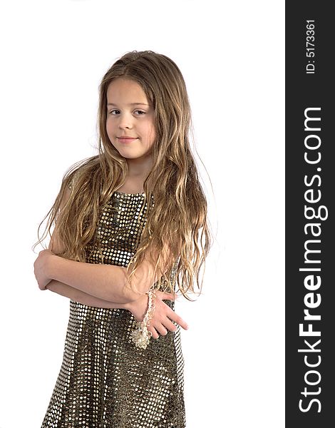 Girl with long brown hair in gold dress standing with crossed arms smiling. Girl with long brown hair in gold dress standing with crossed arms smiling.