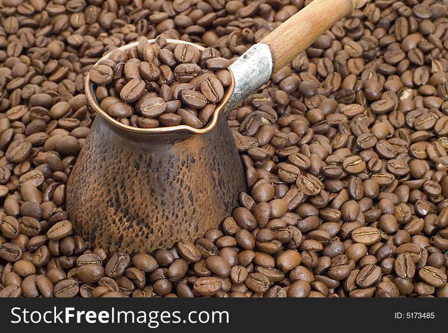 Turkish coffee pot and coffee beans. Turkish coffee pot and coffee beans.