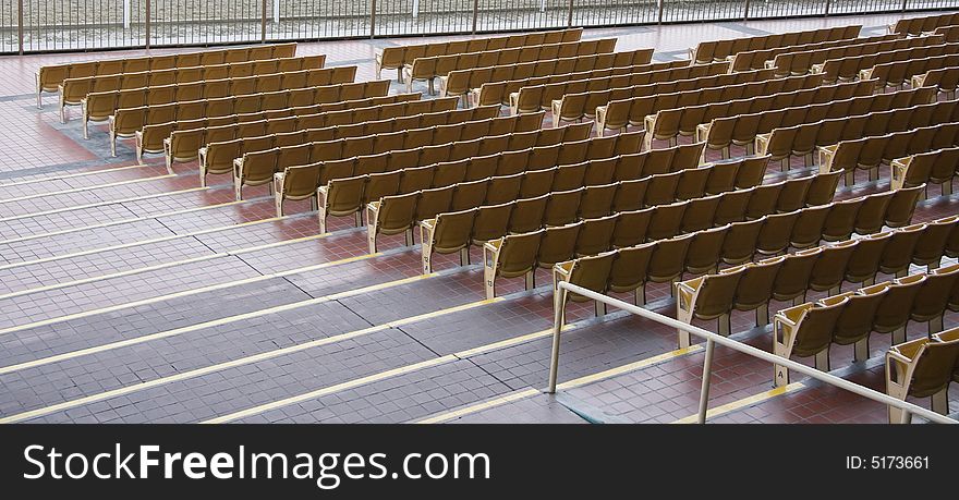 Empty chairs in a stadium. Empty chairs in a stadium