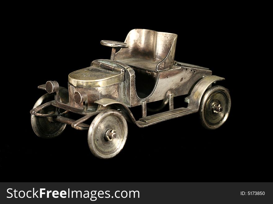 The tiny car. Jewel from bronze, copper, silver. The tiny car. Jewel from bronze, copper, silver.