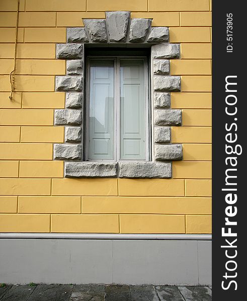 Window with marble frame on yellow wall. Window with marble frame on yellow wall