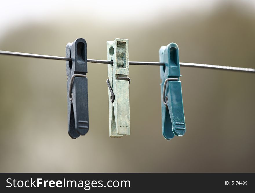 Close up of plastic clothespins on a line