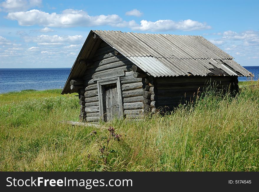 Old wooden shed on the lake bank