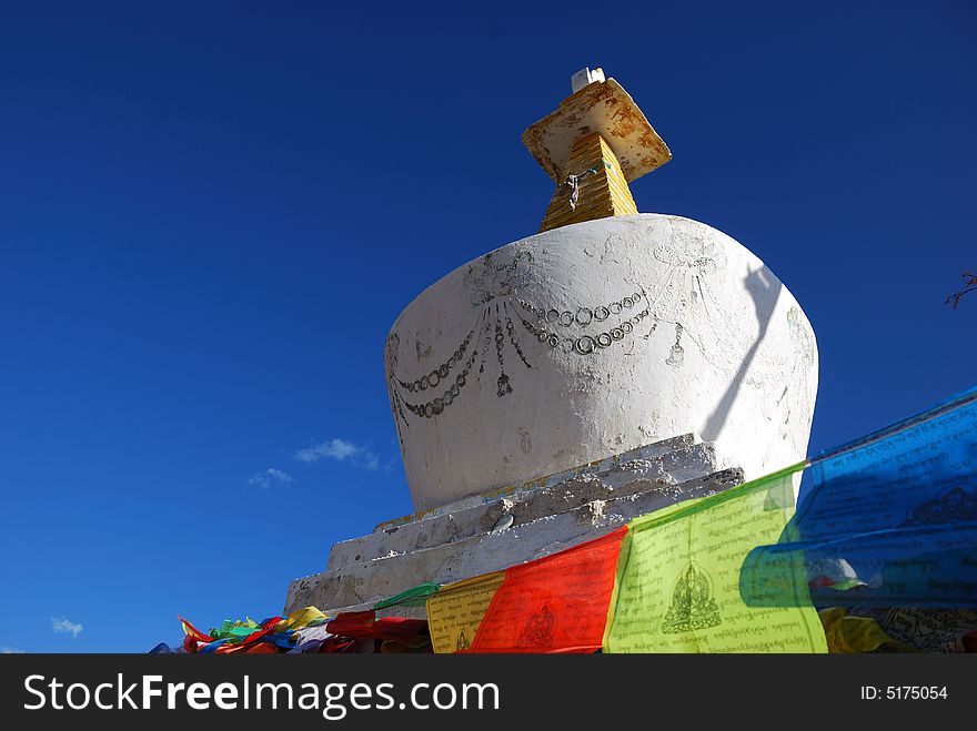 A photo of Tibet buddhism chorten at the foot of Mt.Meili. Which is a holy mountian in Tibet buddhism tales. The chorten is so beautiful in the sunshine.