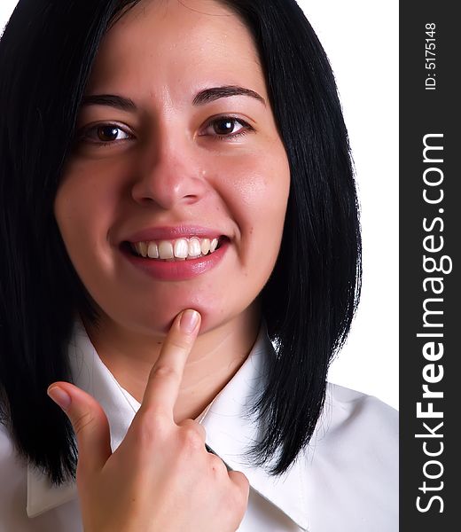 A portrait about a young pretty businesswoman with black hair who is smiling and she has a good idea and she wears a white shirt and a black tie. A portrait about a young pretty businesswoman with black hair who is smiling and she has a good idea and she wears a white shirt and a black tie