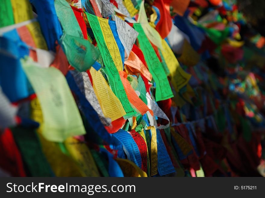 Tihs is a photo of Tibetan prayer flags(OR called Fengma flags in Tibetan). The letions were written on the flags by Titetan for praying and blessing. Tihs is a photo of Tibetan prayer flags(OR called Fengma flags in Tibetan). The letions were written on the flags by Titetan for praying and blessing.
