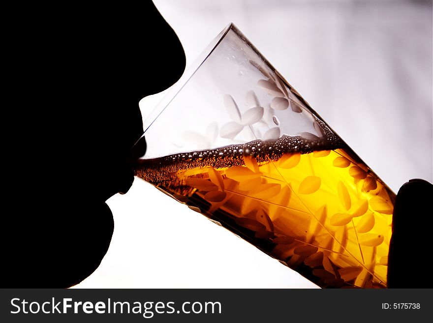 Photo of the silhouette of the woman with glass. Photo of the silhouette of the woman with glass