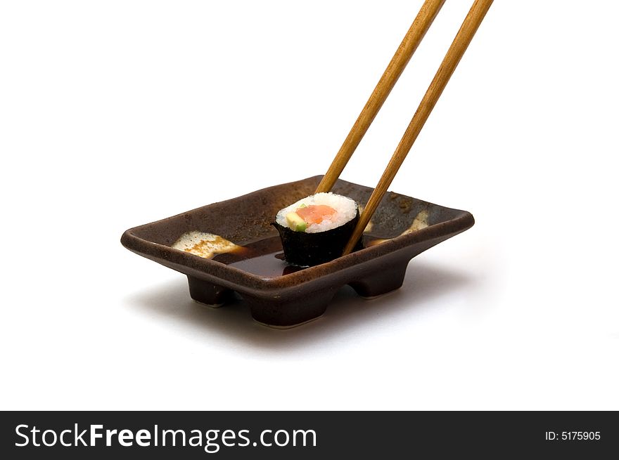 Chopsticks with roll in soy