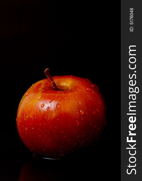 Red apples isolated against a black background