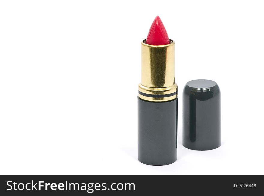 Single red lipstick on white background