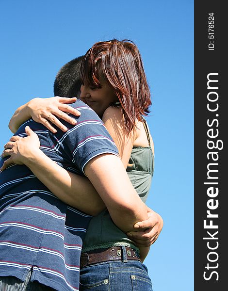 Young couple on the sky background. Young couple on the sky background