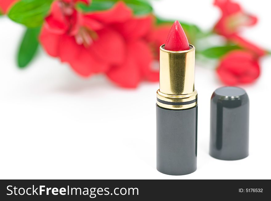 Close up on red lipstick and flower