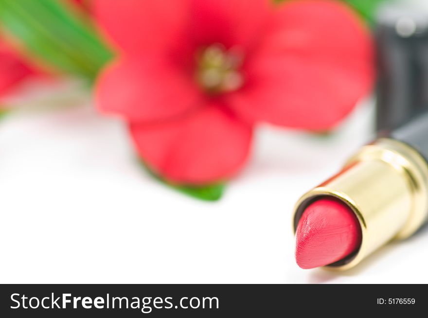 Red lipstick with red flower decoration