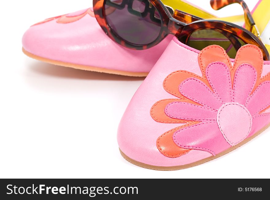 Summer shoes and sunglasses on white background. Summer shoes and sunglasses on white background