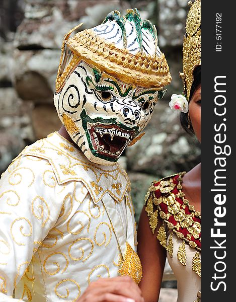 The bayon construction started probably arround 1200 AD during the reign of Jayavarman VII to Jayavarman VIII. Art historians considered that this temple is one of the most enigmatic religious construction in the world.  here  a khon mask man dancer,  on the top terrace of the temple. The bayon construction started probably arround 1200 AD during the reign of Jayavarman VII to Jayavarman VIII. Art historians considered that this temple is one of the most enigmatic religious construction in the world.  here  a khon mask man dancer,  on the top terrace of the temple