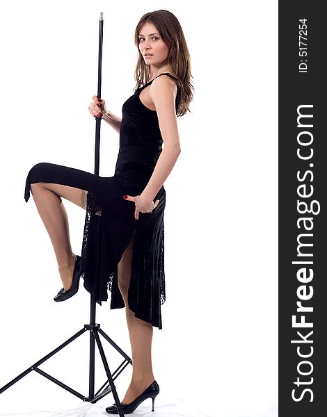 Beautiful dancing girl in black with tripod. Beautiful dancing girl in black with tripod