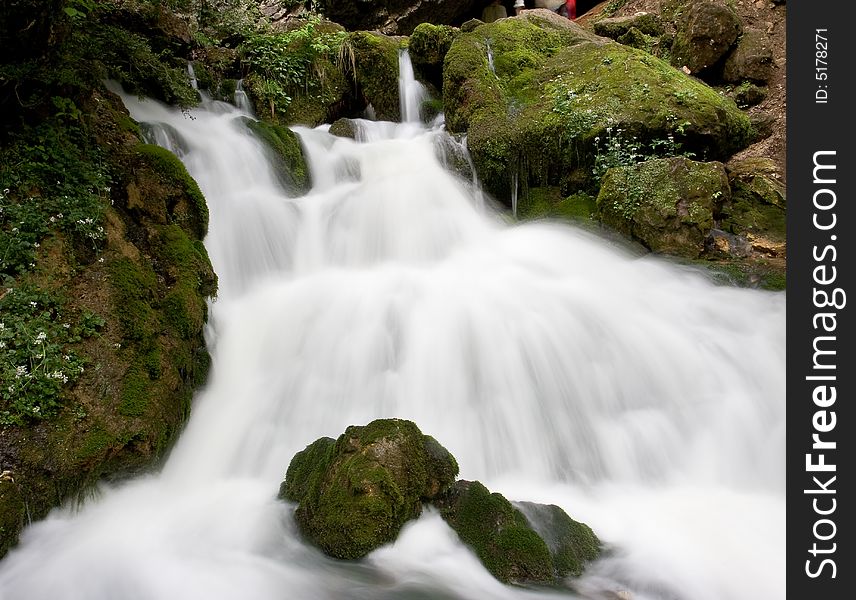 Waterfall among the stones, blurred motion