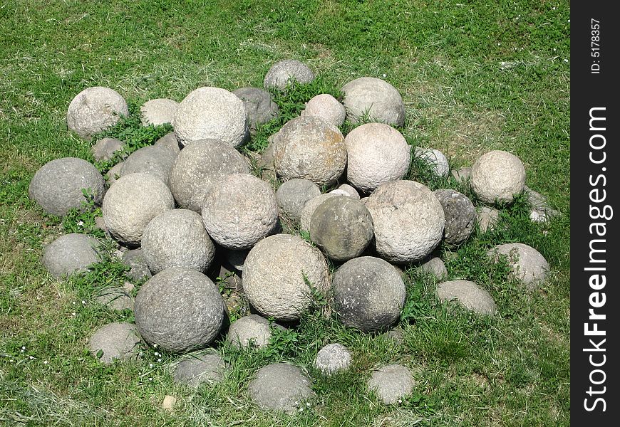Ancient cannon balls on the grass