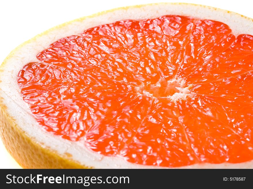 Fresh juicy grapefruit. Close up on a white background. Fresh juicy grapefruit. Close up on a white background.