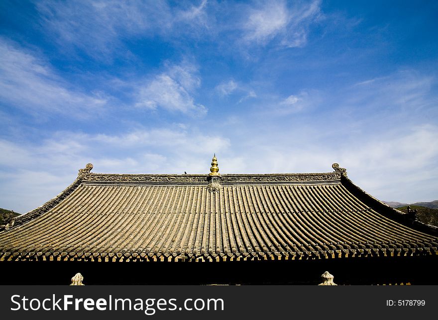 Rooftops of chinese temple and blue sky background. Rooftops of chinese temple and blue sky background