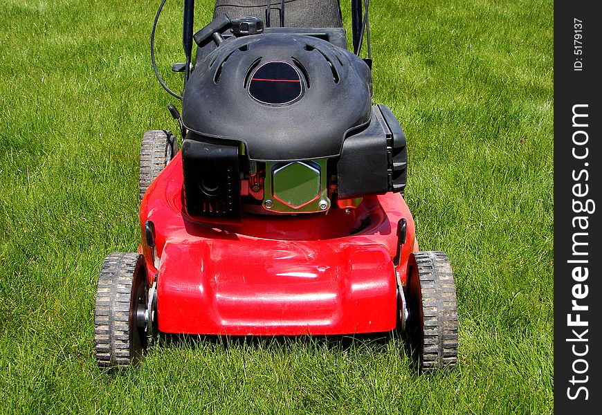 Lawn mower in the grass