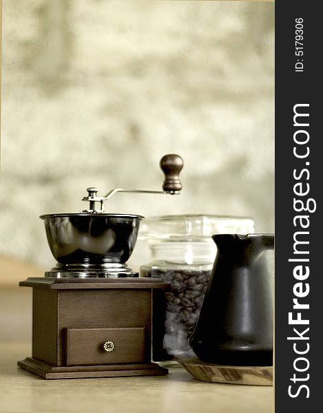 Coffee - grinder with ibric  on a table