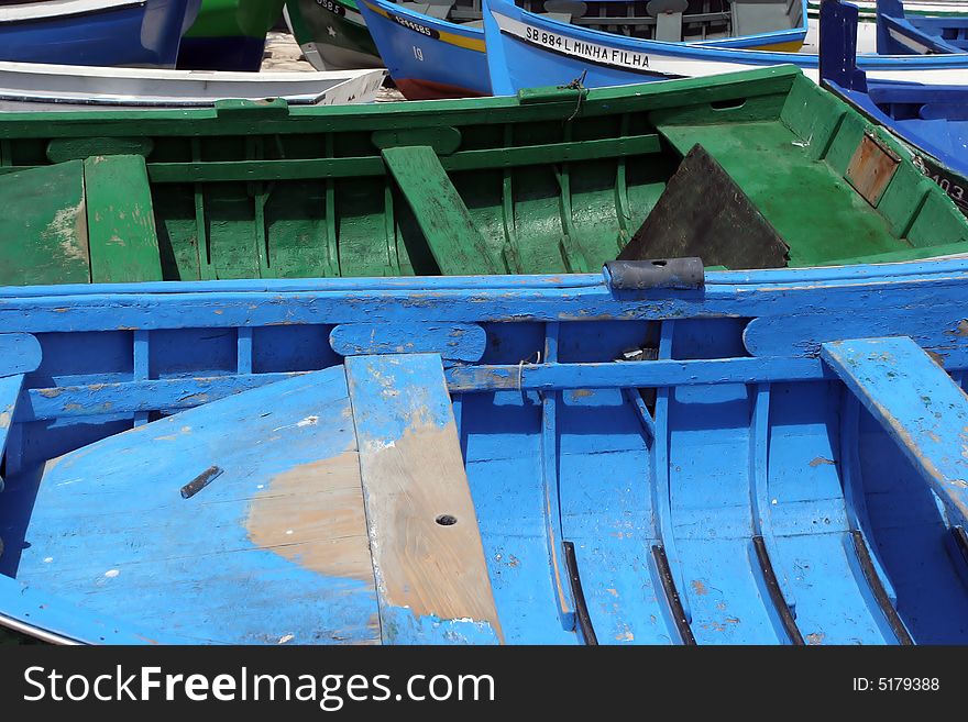 Detail of two boats (green and blue) at the dock. Detail of two boats (green and blue) at the dock