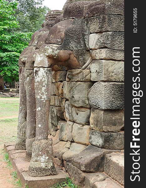 The elephant terrace in the style of bayon date from the 12th century with additions in  late 13th century during the reigns of Jayavarman VII and Jayavarman VIII ; this terrace looking out to the royal square is supported by  the 300 meters of walls of  foundation; these walls  are carved with elephants, garudas and lion headed figures. The elephant terrace in the style of bayon date from the 12th century with additions in  late 13th century during the reigns of Jayavarman VII and Jayavarman VIII ; this terrace looking out to the royal square is supported by  the 300 meters of walls of  foundation; these walls  are carved with elephants, garudas and lion headed figures