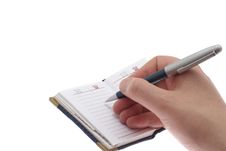 Hand Writes In A Notebook Royalty Free Stock Photos