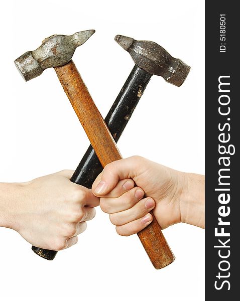 Hands crossing hammers isolated over white background