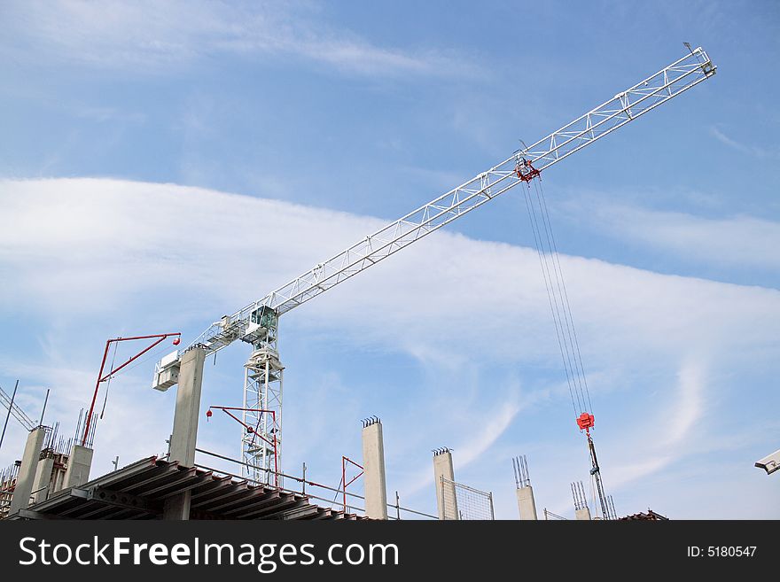 Construction crane against a blue sky. Construction crane against a blue sky