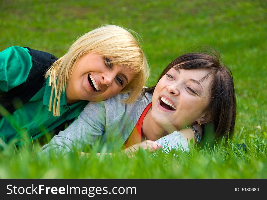 Laughing Happy blonde and brunette playing on the nature. Laughing Happy blonde and brunette playing on the nature