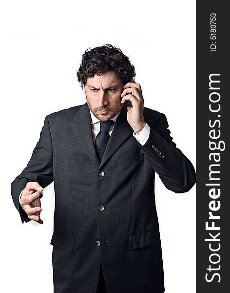 Confident business man talking on mobile phone