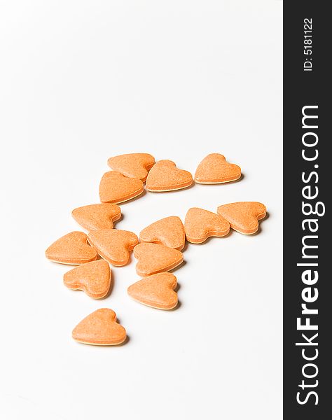 Small orange hearts on a white background