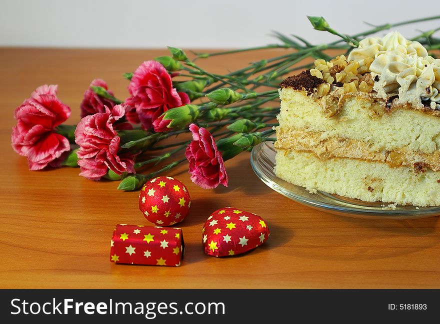 Bouquet Of Flowers And Cake