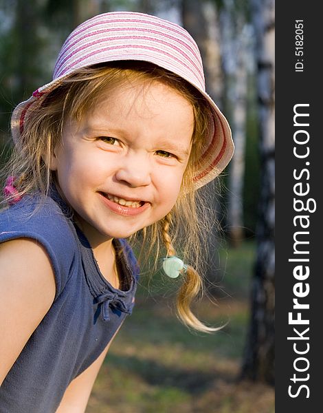 Portrait of a little girl playing in a park with happy sunny smile. Portrait of a little girl playing in a park with happy sunny smile