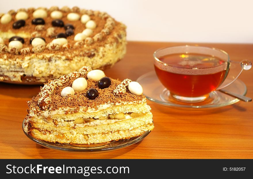 Cup of tea and cake isolated on white background. Cup of tea and cake isolated on white background