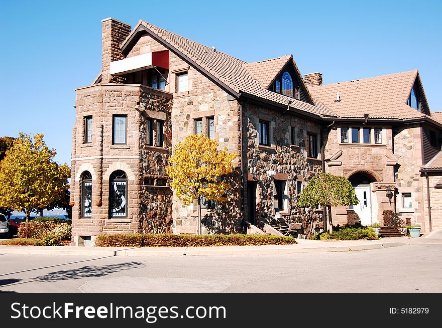 An old restaurant in the fall an the lake Ontario with heavy stone walls.