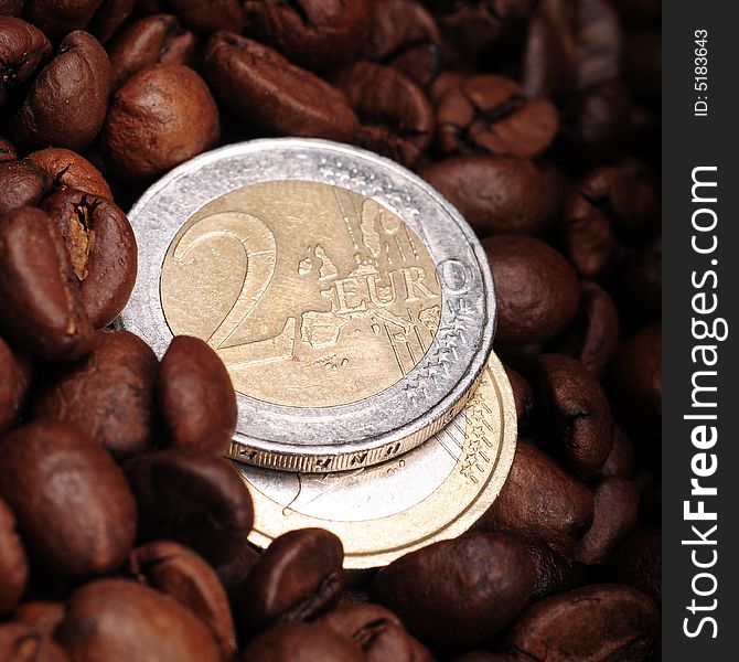 A view with coffee beans and euro coins. A view with coffee beans and euro coins