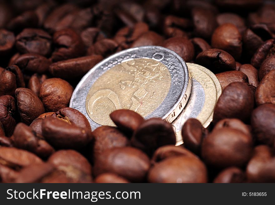 A view with coffee beans and euro coins. A view with coffee beans and euro coins