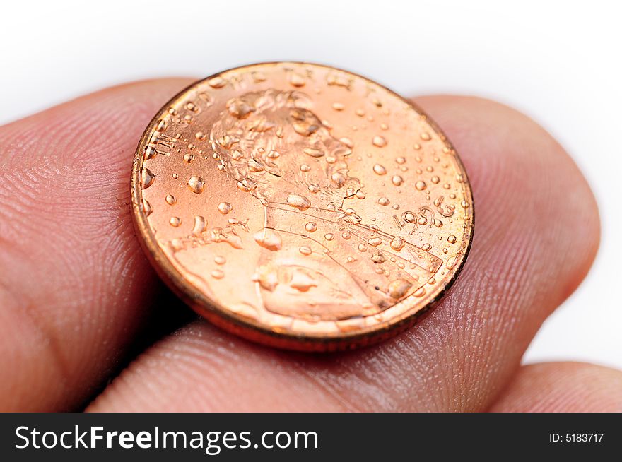 One cent coin detail in hand