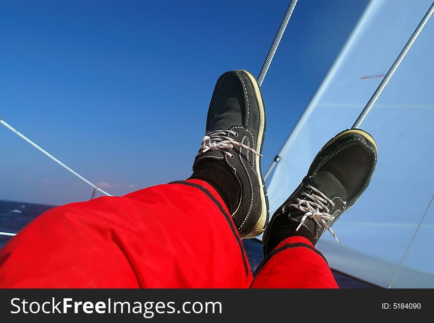 Finding comfortable position at sailing - legs resting. Finding comfortable position at sailing - legs resting